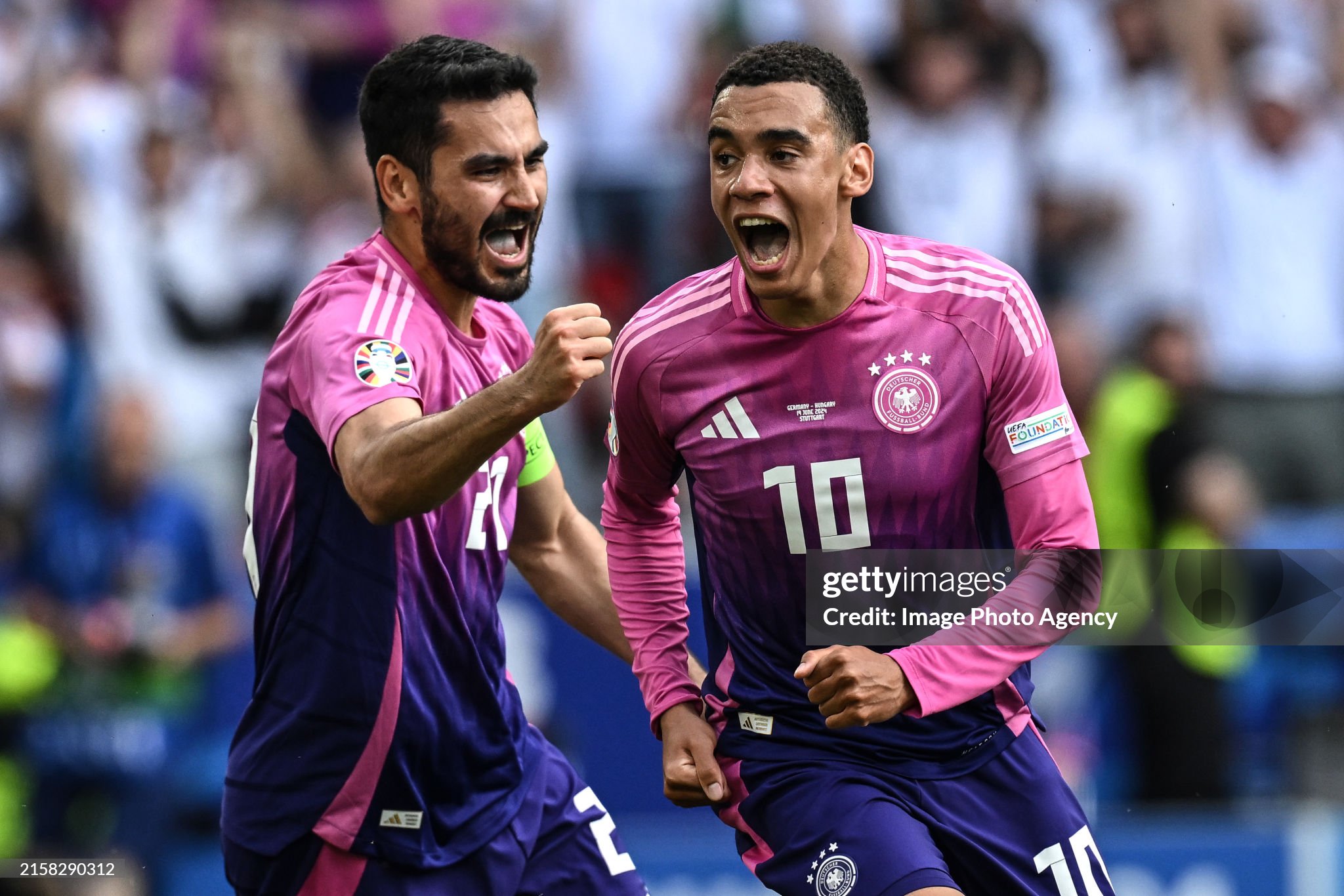 Germany's Jamal Musiala celebrating his goal against Hungary in Euro 2024, alongside Ilkay Gundogan.