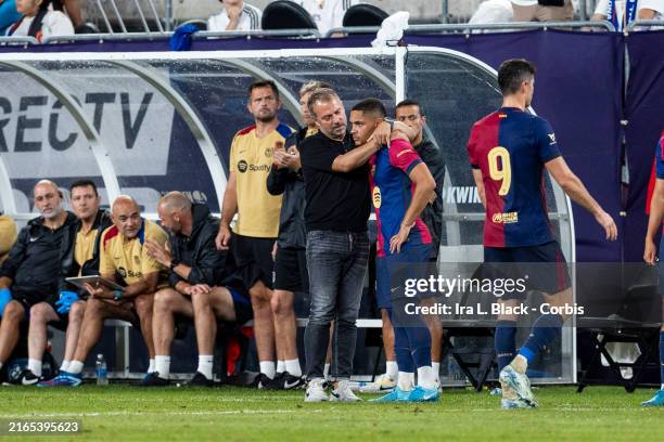 Vitor Roque during a pre-match warm-up at a Barcelona game, looking concerned on the field.